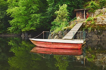 Image showing Red boat on the river