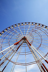 Image showing Ferris wheel and blue sky in sun day