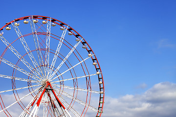 Image showing Ferris wheel and blue sky with clouds