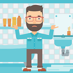 Image showing Man in despair standing near leaking sink.