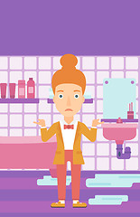 Image showing Woman in despair standing near leaking sink.