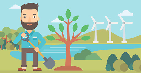 Image showing Man plants tree.