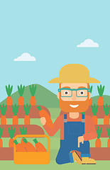 Image showing Farmer collecting carrots.