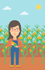 Image showing Farmer holding corn.