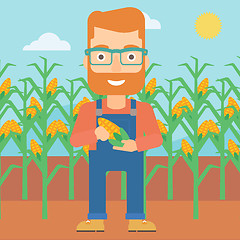 Image showing Farmer holding corn.