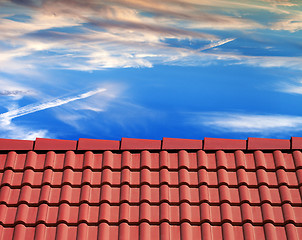 Image showing Roof tiles and sunset sky