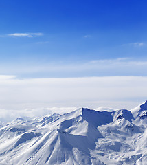 Image showing Snowy mountains in sunny day