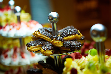 Image showing Dessert table for party. akes and sweetness. Shallow dof