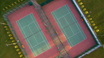 Image showing Aerial view of two tennis courts