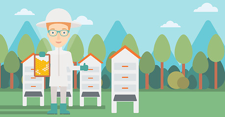 Image showing Bee-keeper at apiary.