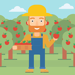 Image showing Farmer collecting apples.