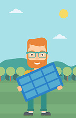 Image showing Man holding solar panel.