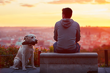 Image showing Man with dog at the sunrise