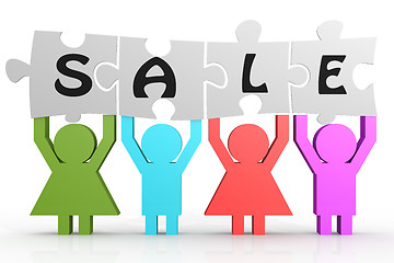Image showing Four people hold puzzle with sale word