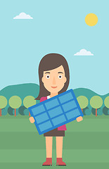 Image showing Woman holding solar panel.