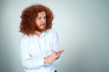 Image showing The young man looking at camera