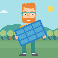 Image showing Man holding solar panel.