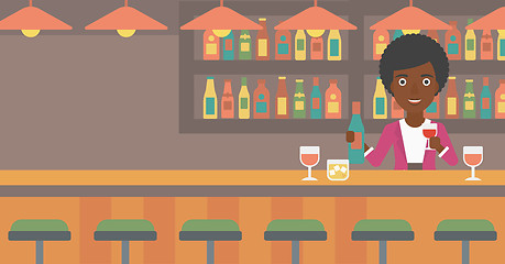 Image showing Bartender standing at the bar counter.