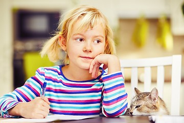 Image showing Girl is doing homework 