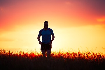 Image showing Athletic runner at the sunset
