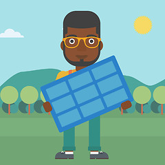 Image showing Man holding solar panel.