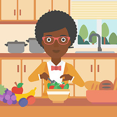 Image showing Woman cooking vegetable salad.