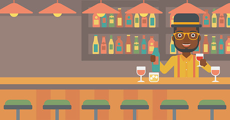 Image showing Bartender standing at the bar counter.