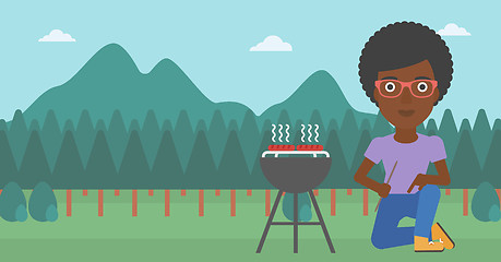 Image showing Woman preparing barbecue.