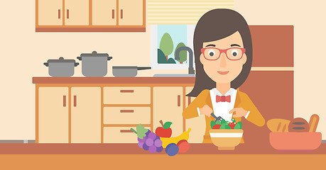 Image showing Woman cooking vegetable salad.