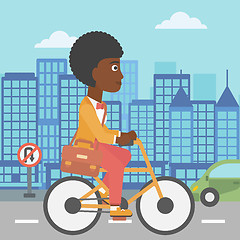 Image showing Woman cycling to work.