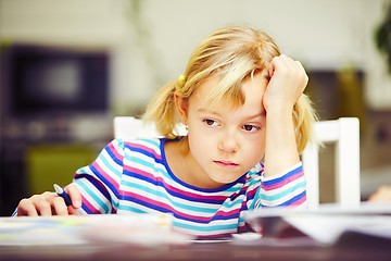 Image showing Girl is doing homework 