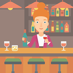 Image showing Bartender standing at the bar counter.