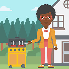 Image showing Woman preparing barbecue.