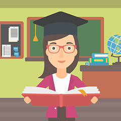 Image showing Woman in graduation cap holding book.