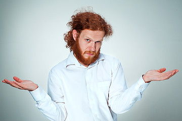 Image showing The young man looking at camera