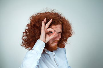 Image showing The young man looking at camera