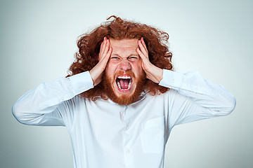 Image showing Stressed businessman with a headache