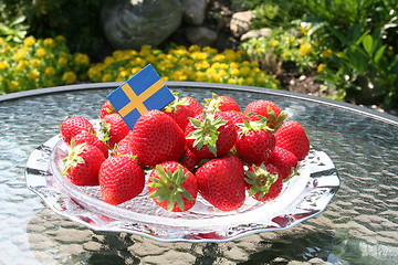 Image showing Swedish strawberries for Midsummer with flag on top