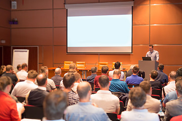 Image showing Business speaker giving a talk in conference hall.