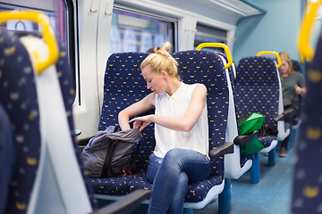 Image showing Woman travelling by train.