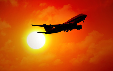 Image showing jet flying in sunset