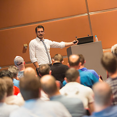 Image showing Business speaker giving a talk in conference hall.