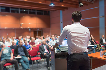 Image showing Public speaker giving talk at Business Event.