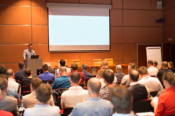 Image showing Business speaker giving a talk in conference hall.