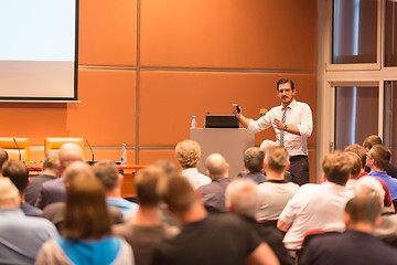 Image showing Business speaker giving a talk in conference hall.