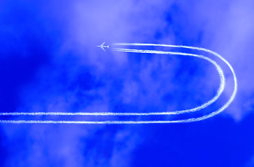 Image showing  Airplane in the sky with jet trail