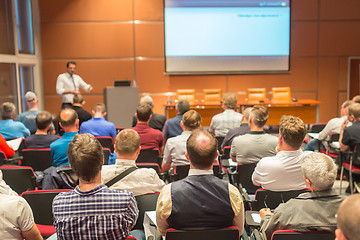 Image showing Business speaker giving a talk in conference hall.