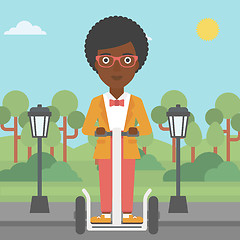 Image showing Woman riding on electric scooter.