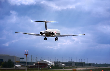 Image showing  jet landing at dusk.