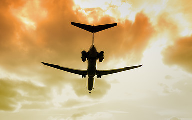 Image showing  jet landing at dusk.